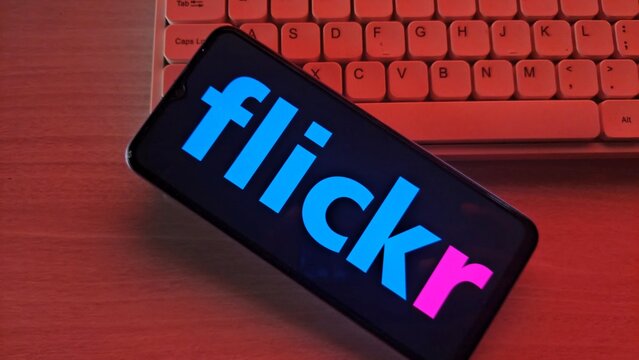 Smartphone displaying flickr app on screen with keyboard