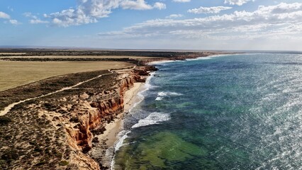 Red Banks Beach, Arno Bay, South Australia &ndash; aerial drone view of rugged limestone cliffs, turquoise ocean, sandy coastline and remote Eyre Peninsula seascape
