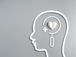 Minimal head shape with white geometric strong heart and medical icon, symbolizing mental health check, emotional wellbeing, psychological care, and mindfulness in modern healthcare concept.