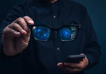 Smart glasses with augmented reality interface showing digital data and futuristic UI holding in businessman hands. Concept of wearable technology, AR innovation, and next-generation smart devices.