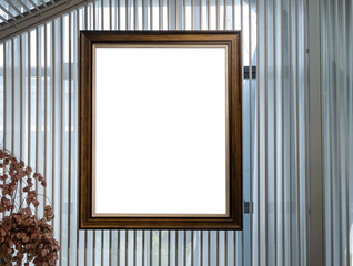 Vertical wooden photo frame mockup on wooden slats background decoration in gallery, perfect for showcasing artwork, photography, or poster design in a realistic home interior setting.