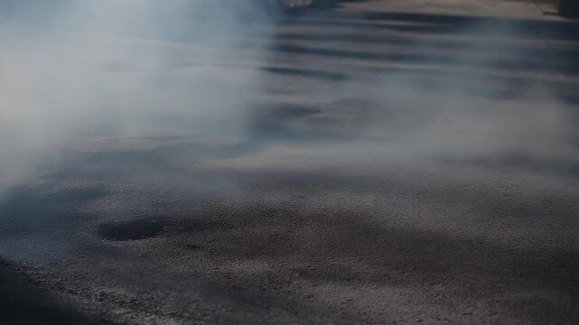 Smoky haze over textured, dark, and muted ground