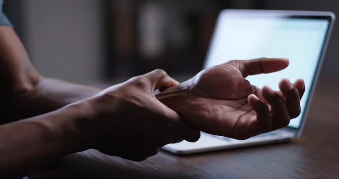 Person interacting with laptop.
