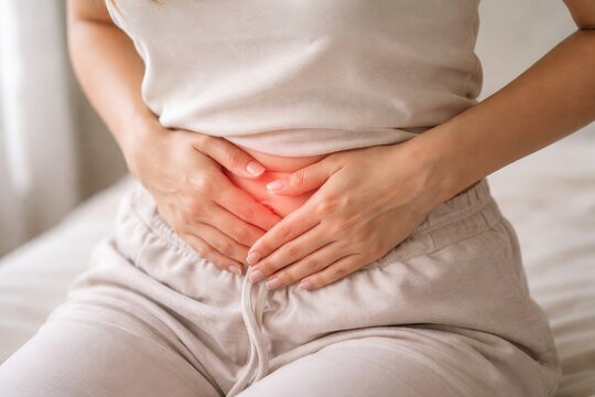 Woman stomach pain uterine myoma fibroids endometrial polyp abdomen cramp health