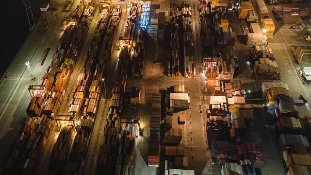 A dynamic aerial time-lapse capturing the rhythmic pulse of global trade at a bustling port, with massive container ships and synchronized cranes under dramatic skies.