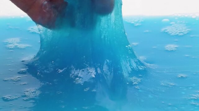 a blue slime with blue water splash