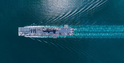 Nuclear ship warship Military navy ship carrier full loading fighter jet aircraft and Helicopters sailing in the ocean. Military warship deck loaded with fighter jets Naval defense power army force © Yellow Boat