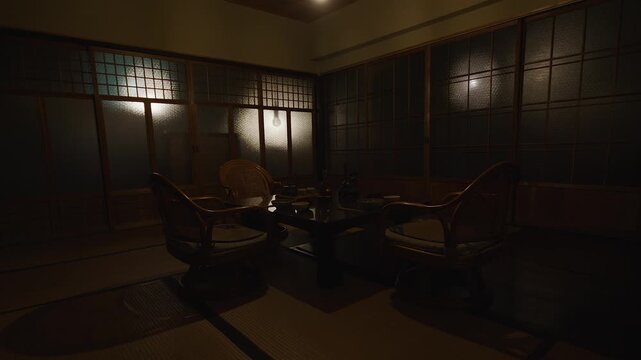 Pan across dimly-lit traditional Japanese dining room in Kiso Valley