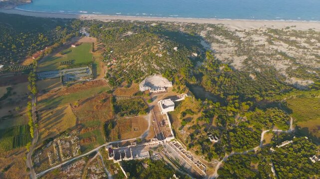 Gelemis, Turkey. Patara Ancient Theatre, Colonnaded Street, Bouleuterion Parliament, Vespasian Baths and Small Baths on Kursunlu Tepecik Hill in summer morning. Aerial View, Point of interest