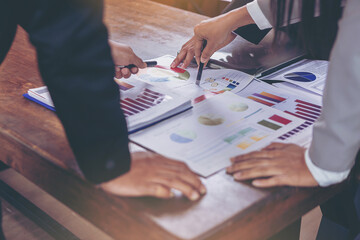 Business peoples meeting to discuss the situation on business plan, marketing for investment. Selected focus