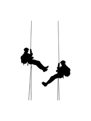 Silhouette Climbers on Ropes