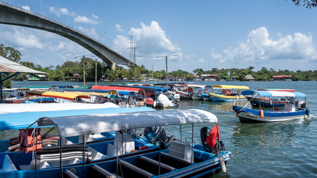 R&iacute;o Dulce, Guatemala &ndash; View of Lake Izabal at the river&rsquo;s source, a key ecotourism hub and gateway to rainforest canyons and Caribbean waters, with the Puente de R&iacute;o Dulce in the background.