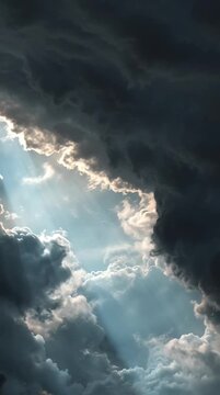 Dramatic Sunbeams Bursting Through Dark Storm Clouds
