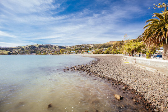 Beach and water in the French settlement of Akaroa on Banks Peninsula in New Zealand