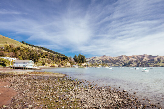 Beach and water in the French settlement of Akaroa on Banks Peninsula in New Zealand