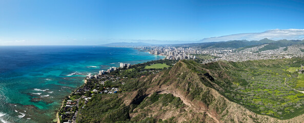 Aerial panorama of Honolulu Waikiki Beach from distance, Diamond Head Mountain famous lookout point in the foreground