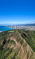 High angle view of Diamond Head Mountain famous lookout point in Honolulu, Hawaii. View of Waikiki Beach and ocean in background