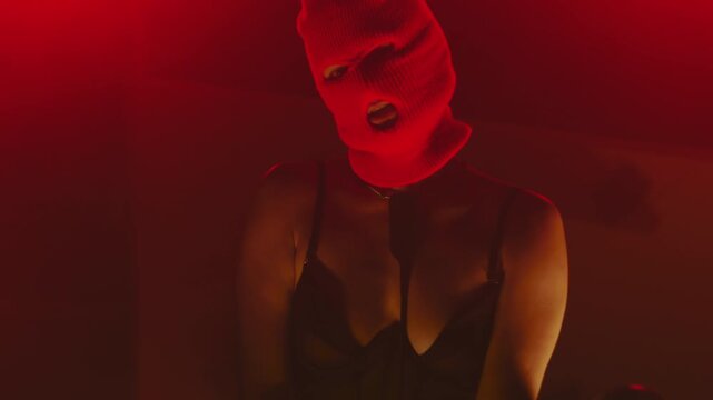 Sexy girl in a red balaclava