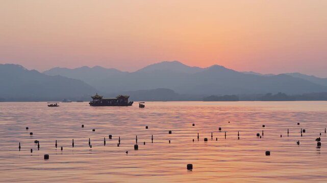 The atmosphere of a sunset and scenic boat ride on the Xihu Lake in Hangzhou, China