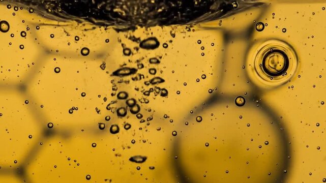 Vibrant Golden Yellow Viscous Liquid Surface Macro Texture with Bubbles