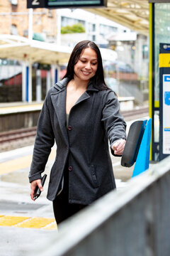 Maori woman on a suburban train platform in Auckland