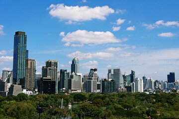 Fototapeta premium Cityscape of Silom downtown area with Lumphini Park, Bangkok Thailand
