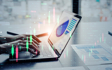Business people using laptops and financial charts concept