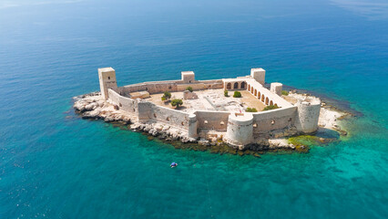 Kizkalesi, Mersin, Turkey. Aerial view of Maiden's Castle on island in Mediterranean Sea, surrounded by water, summer day.. Aerial View