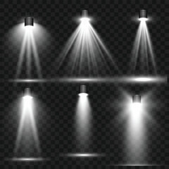 Realistic White Stage Spotlights and Light Beam Effects Set on Transparent Background. Vector