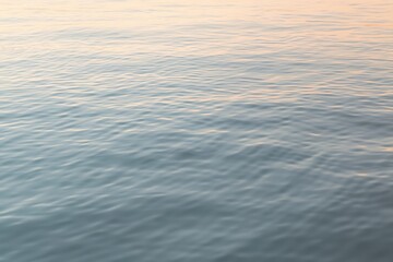 Generative AI Serene Ocean Surface with Gentle Ripples at Sunrise Scene