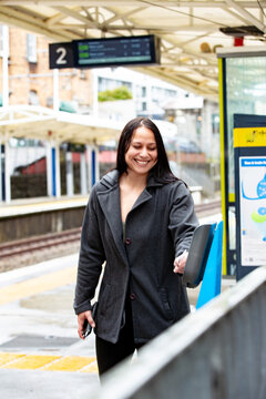 Maori woman on a suburban train platform in Auckland