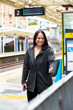 Maori woman on a suburban train platform in Auckland