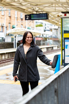 Maori woman on a suburban train platform in Auckland