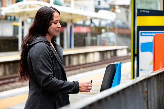 Maori woman on a suburban train platform in Auckland