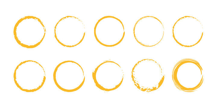 Set of ten hand-drawn yellow circular grunge frames for design elements