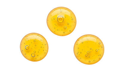 Fototapeta premium Three Golden Serum Drops with Bubbles on Transparent Background