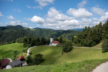Fototapeta premium Saint Barbara church in Škofja loka hills in Slovenia