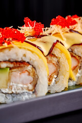Gourmet Sushi Roll with Prawn, Cream Cheese, and Melted Cheese Topping.