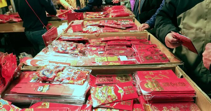 January 12, 2025, Taipei, Taiwan: The bustling red envelope stalls at the Dihua Street Lunar New Year Market.