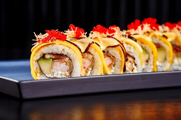 Gourmet Sushi Roll with Prawn, Cream Cheese, and Melted Cheese Topping.