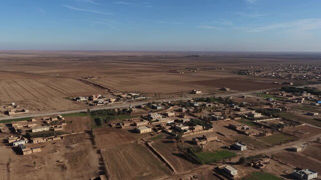 Drone shot capturing the vast, arid desert environment surrounding Al-Shaddadi in Al-Hasakah province, Northeast Syria. 