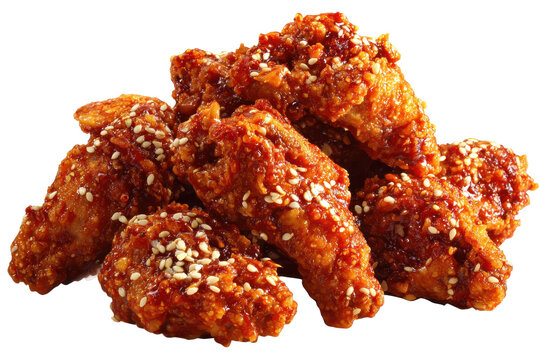 Spicy korean fried chicken wings with sesame seeds isolated on transparent background. Crispy sesame fried chicken wings in spicy glaze isolated on white background.