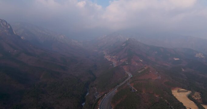 Majestic granite peaks of Ulsanbawi with scenic mountain road, South Kore
