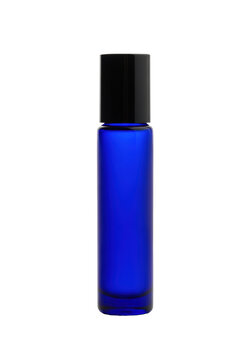 Perfectly cylindrical rich cobalt blue glass roller bottle topped with a matte black cap, standing on a reflective white surface with soft studio lighting, creating a premium cosmetic packaging