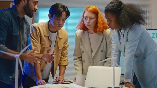 group of multiethnic businesspeople in team meeting,using tablet computer for Net zero,ESG topic presentation on monitor. Sustainable business practice,global warming,earth day,ESG team concept