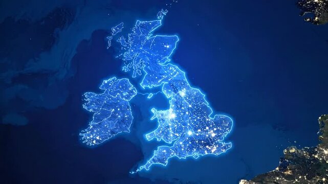 Satellite view of the United Kingdom at night, showcasing city lights.
