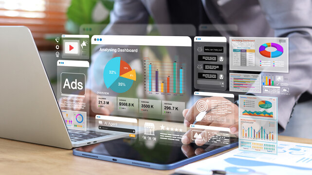 Business analytics and AI marketing dashboard displayed on digital tablet and laptop. Data visualization, advertising performance, automation, and business intelligence concept.