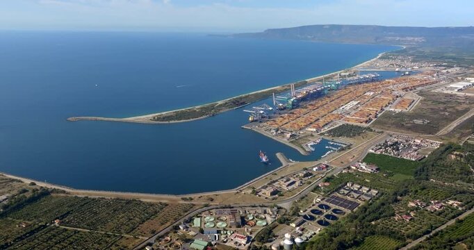 Aerial view of the industrial port of Gioia Tauro, located in the province of Reggio Calabria. It is the largest port in Italy by container throughput and the sixth largest in the Mediterranean Sea.