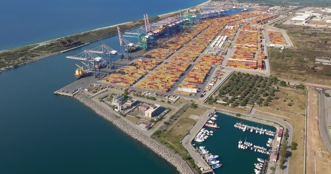 Aerial view of the industrial port of Gioia Tauro, located in the province of Reggio Calabria. It is the largest port in Italy by container throughput and the sixth largest in the Mediterranean Sea.