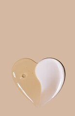 creamy texture of cosmetic samples on a pastel beige background